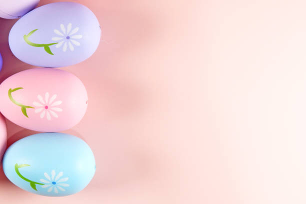 istock Pastel colorful Easter eggs on pink background stock photo copy space 2025288924