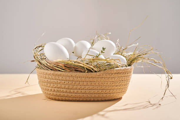 istock Wicker basket with farm natural white eggs. 2025289454