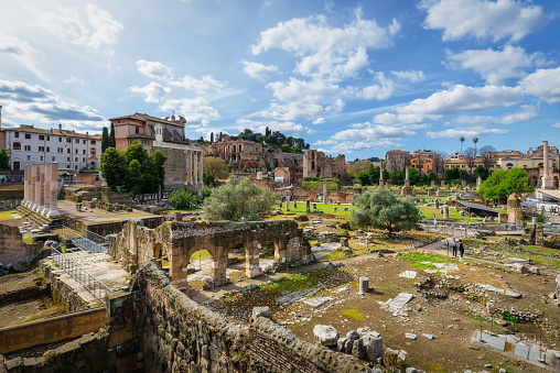 World famous Imperial Fora with a beautiful sky. Ruins of Foro Romano, Palatine Hill, excavation site with many columns and remains of Roman Empire. Rome, Italy