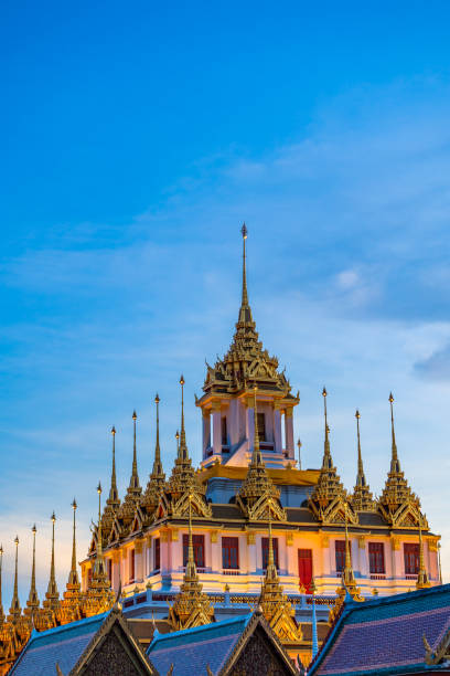istock Beautiful sunset at Loha Prasat (metal castle) Wat Ratchanatda. The famous destination in Bangkok, Thailand. 2025300042