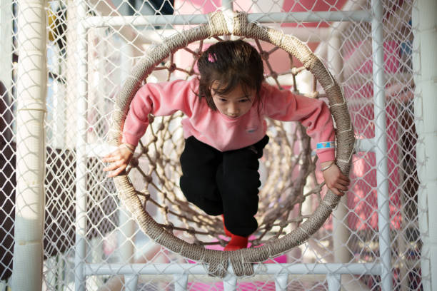 Girl playing in children's playground