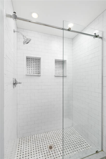 istock A walk-in shower with white subway tiles. 2025317146