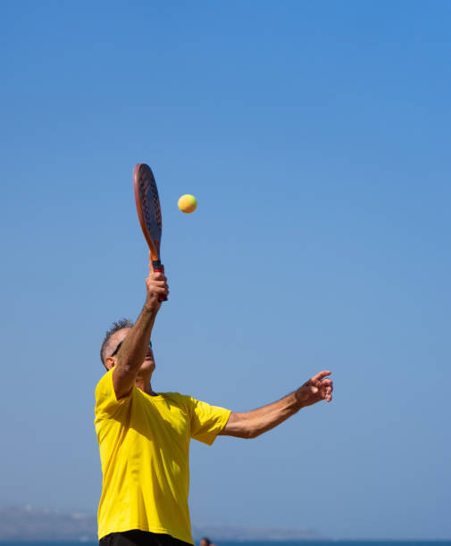 istock Mature man playing beach tennis 2025327257