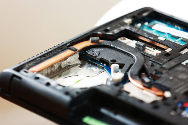 istock Fixing laptop. Repairman holds cooling fan and repairs from overheating. Disassembling computer, replacement, clean dust and dirt cooling system on notebook. Professional electronic device service 2025351801