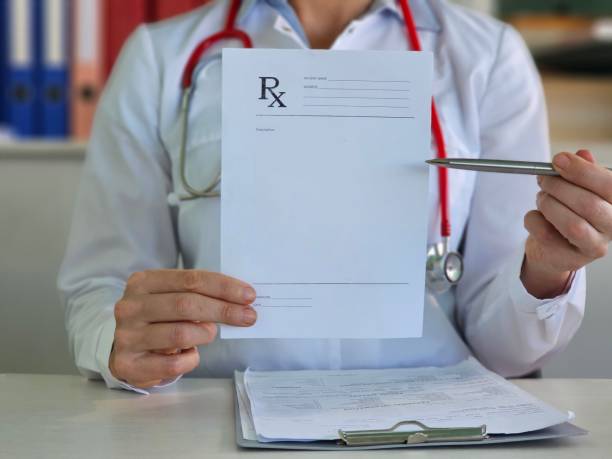 istock Pharmacist holds blank prescription in pharmacy 2025374117