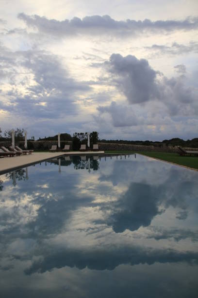 istock dramatic sky reflecting in the swimming pool 2025374133