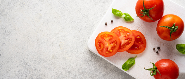 Fresh and ripe tomatoes on white background