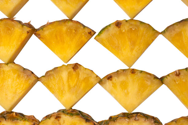 Pineapple juicy yellow slices on a white background. Top view.