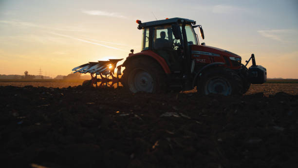 istock Agricultural Field Getting Plowed Through Tractor By Farm Worker 2025401088