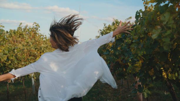 istock Joyful Woman with Outstretched Arms in Vineyard 2025405985