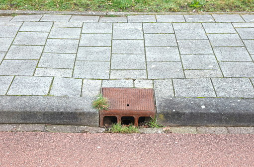 Manhole cover in a dutch street, selective focus