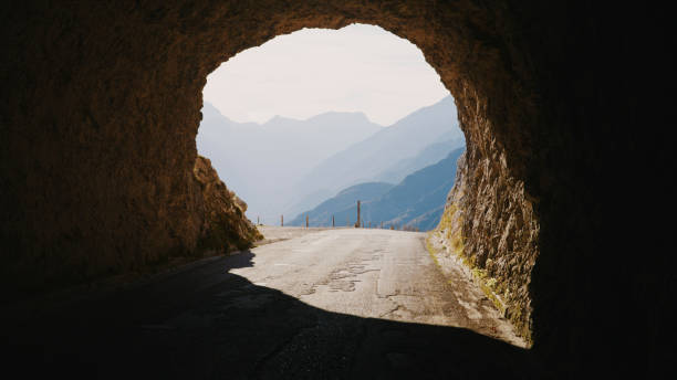 istock Sunlight Streaming Through Rocky Tunnel Amid Mountains 2025411394