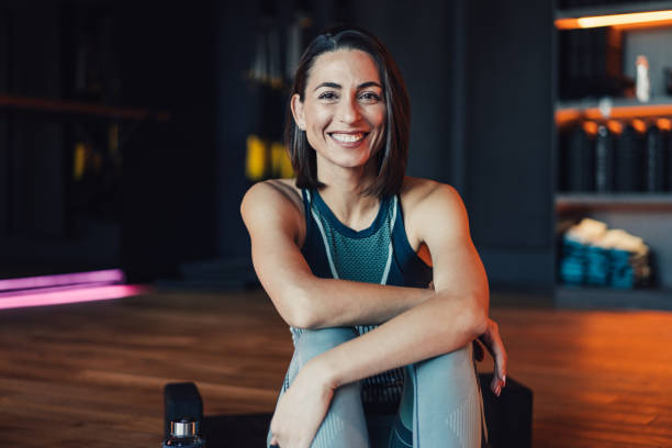 istock Confident young woman working out in a gym. 2025412481