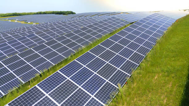 istock Drone Point Of View Solar Panels In A Row On Rural Farm 2025416849