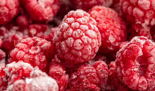 istock Frozen raspberries and blackberries close-up macro photography 2025421241