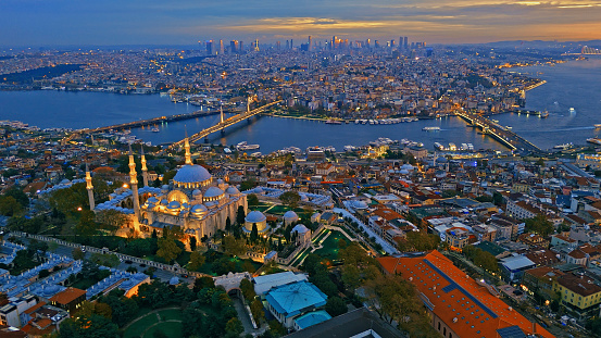 As Dusk Descends upon Istanbul,Turkey,an Aerial View Captures the Hagia Sophia Mosque Rising Majestically amidst the Cityscape by the Tranquil Sea. Illuminated by the Warm Glow of Evening Lights,This Historic Marvel Stands as a Timeless Symbol of the City's Cultural Heritage and Architectural Magnificence