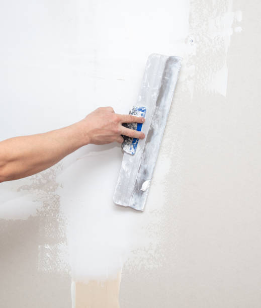 istock A man is plastering a wall in the house 2025428935