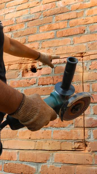 cutting a contour to make a window opening in a brick wall