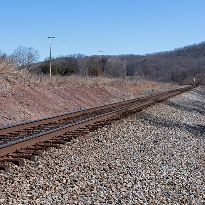 Railroad tracks on top of gravel ballast