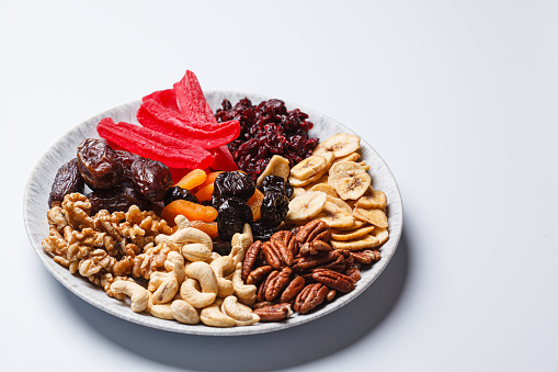 Dried fruits and nuts on a plate to celebrate the Jewish holiday Tu Bi Shevat.