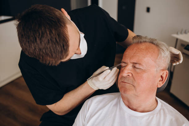 istock a plastic surgeon measures the face of an elderly man 2025431233