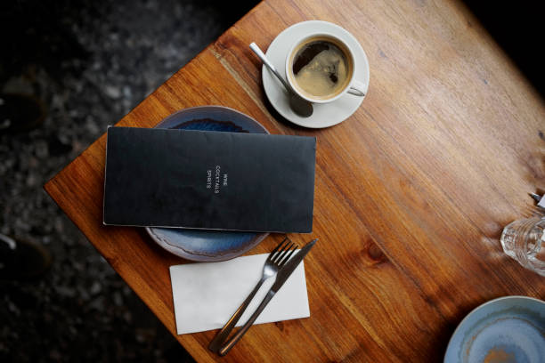 Coffee shop, above and restaurant drink or table top or menu or caffeine aroma or breakfast, beverage or wooden.  Cafe, cup and top view or black americano in Italy or relax holiday, weekend or plate