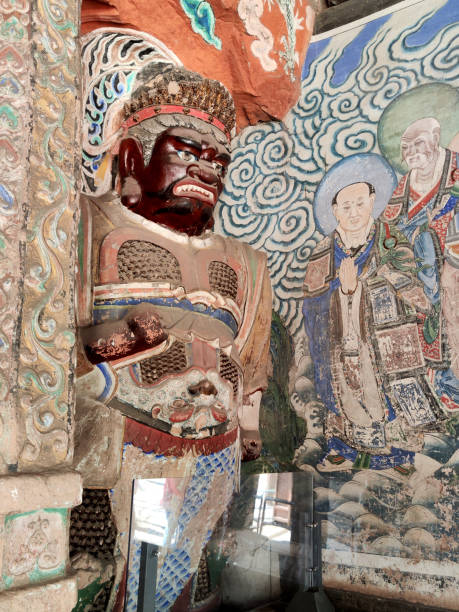 Buddhist image in Cave 6, one of the richest of the Yungang sites.  It was constructed between 465 and 494 C.E. by Emperor Xiao Wen. The entire interior of the cave is carved and painted. The walls of the upper stories are host to carvings of standing Buddhas, Bodhisattvas, and monks among other celestial figures. Yungang Grottoes, are excellent examples of rock-cut architecture and one of the three most famous ancient Buddhist sculptural sites of China. The others are Longmen and Mogao.