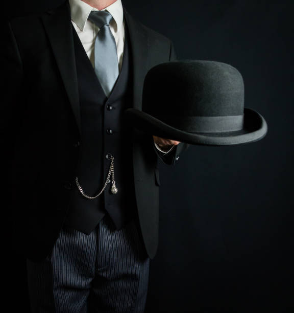istock Butler Holding Bowler Hat 2025446924