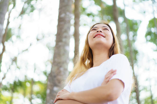istock Asian woman enjoying in forest. 2025452221