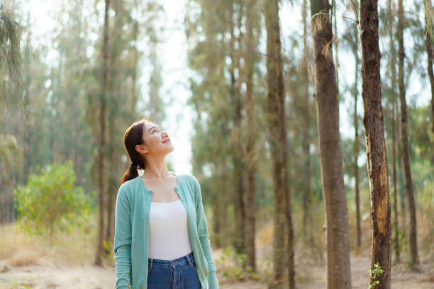 istock Asian young woman relaxing in nature. 2025454049