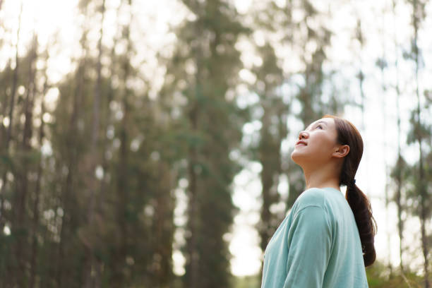 istock Asian young woman relaxing in nature. 2025454748