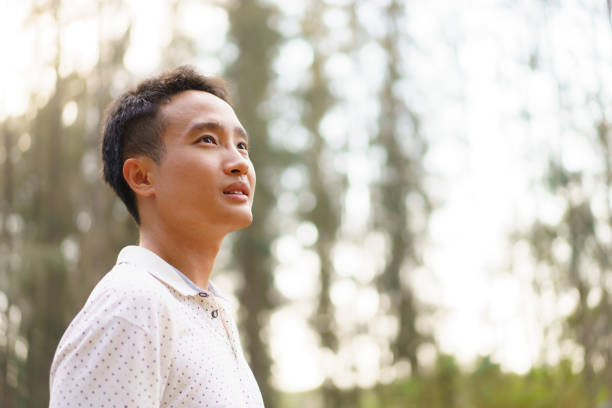 istock Asian young man relaxing in the nature. 2025454954