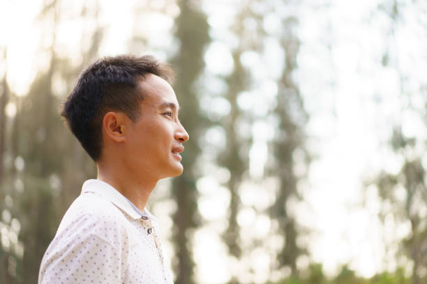 istock Asian young man relaxing in the nature. 2025454957