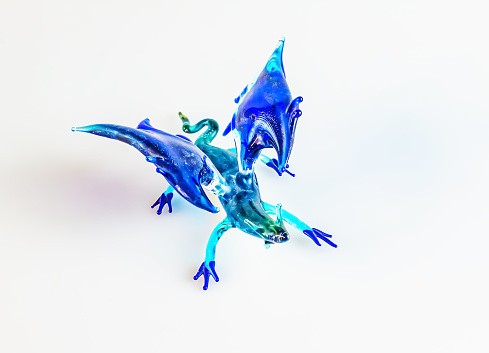 Handmade glass dragon on a white background. Symbol of 2024.