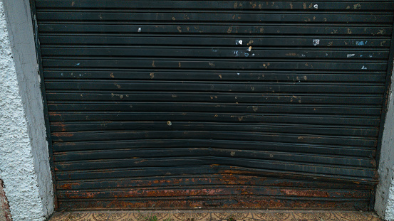 Dented and rusty steel commercial door