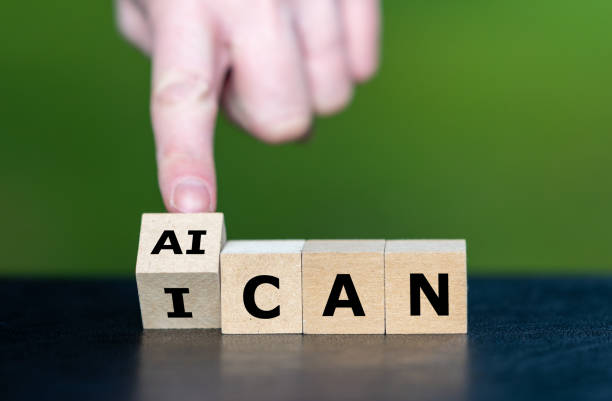 istock Hand turns wooden cube and changes the expression 'I can' to 'AI can'. Symbol for jobs done by artificial intelligence. 2025493302