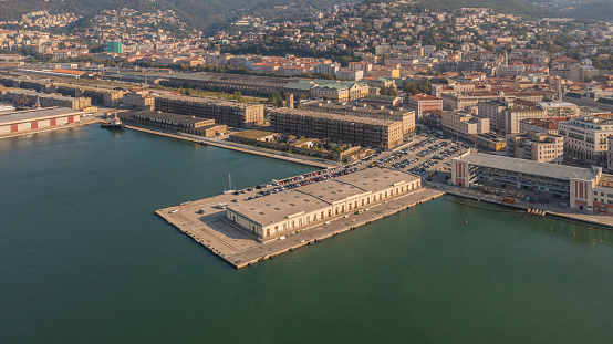 Drone aerial view of Grand canal with boats in Trieste, Italy Trieste’s location at the top of the Adriatic has always defined it Trieste is the polyglot capital of the northeastern Italian province of Friuli Venezia Giulia