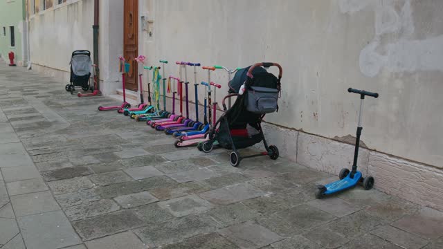 Scooters and Stroller Lined in Venice Alley, Italy