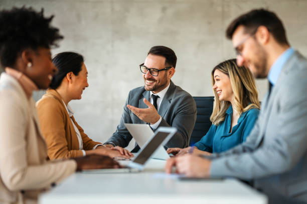 istock Multicultural professional businesspeople working together on research plan in boardroom. 2025536706