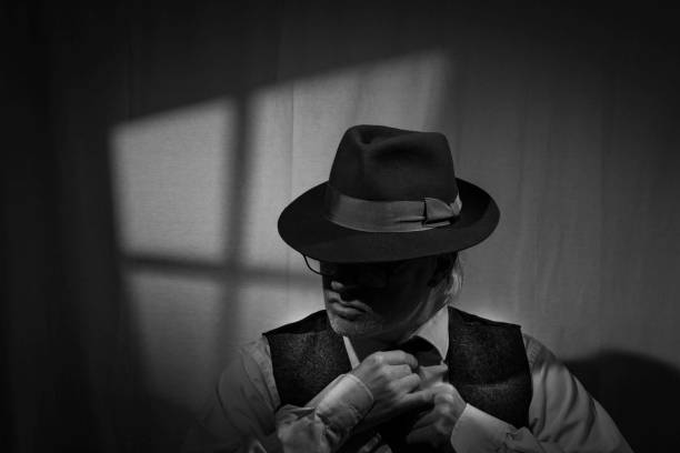 istock Film Noir detective in dark office 2025554623