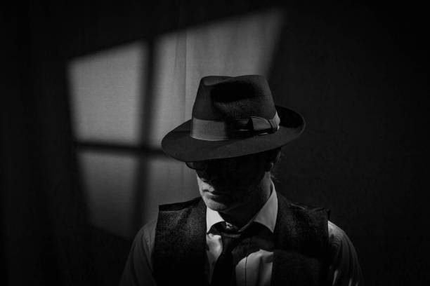 istock Film Noir detective in dark office 2025554627