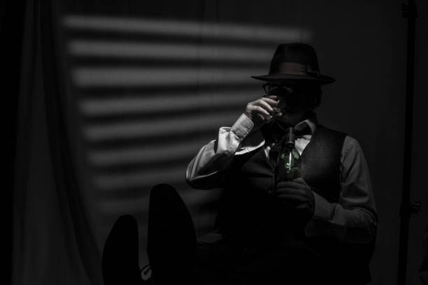 Film Noir style detective drinking and wearing a Fedora hat, tie and waistcoat in a dark, seedy office with a stylized Venetian blind window behind. The face is partially obscured by the hat brim and shadow.