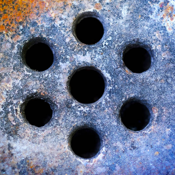 Detail of old worn textured water faucet drain rusted and colorful