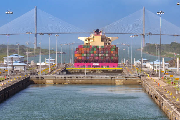 Colon, Panama - 23 January 2024: Agua Clara locks on the Panama canal. In the background is a container ship and the Atlantic Bridge