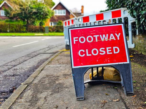 Footpath closed sign due to engineering work on residential street