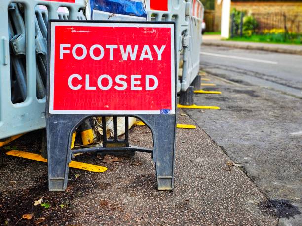 istock Footpath closed sign due to engineering work on residential street 2025577283