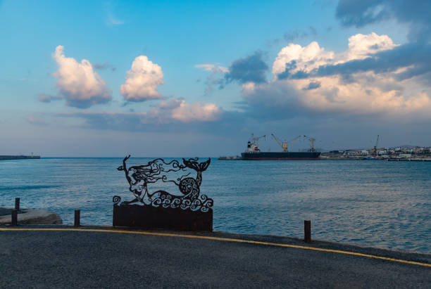 Heraklion, Crete, Greece - October 2, 2023: A picture of The Mermaid Sculpture at the Heraklion breakwater, at sunset.