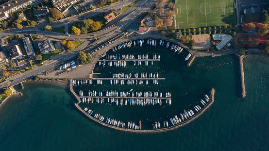 drone aerial view of Lutry Vuad vevey cityscape Top down view of boats in the Marina in Lausanne at geneva lake in Switzerland