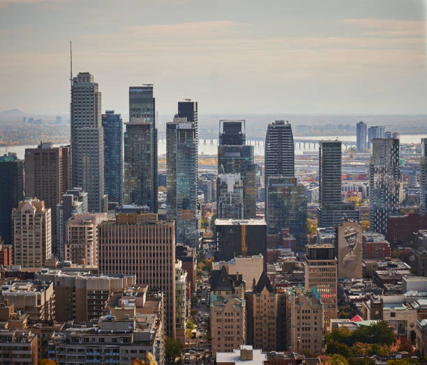 Montreal panorama at dusk seen from the Mount Royal park viewpoint. Quebec, Canada.