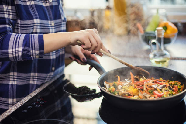istock Woman steaming mixed vegetables in the kitchen 2025711567